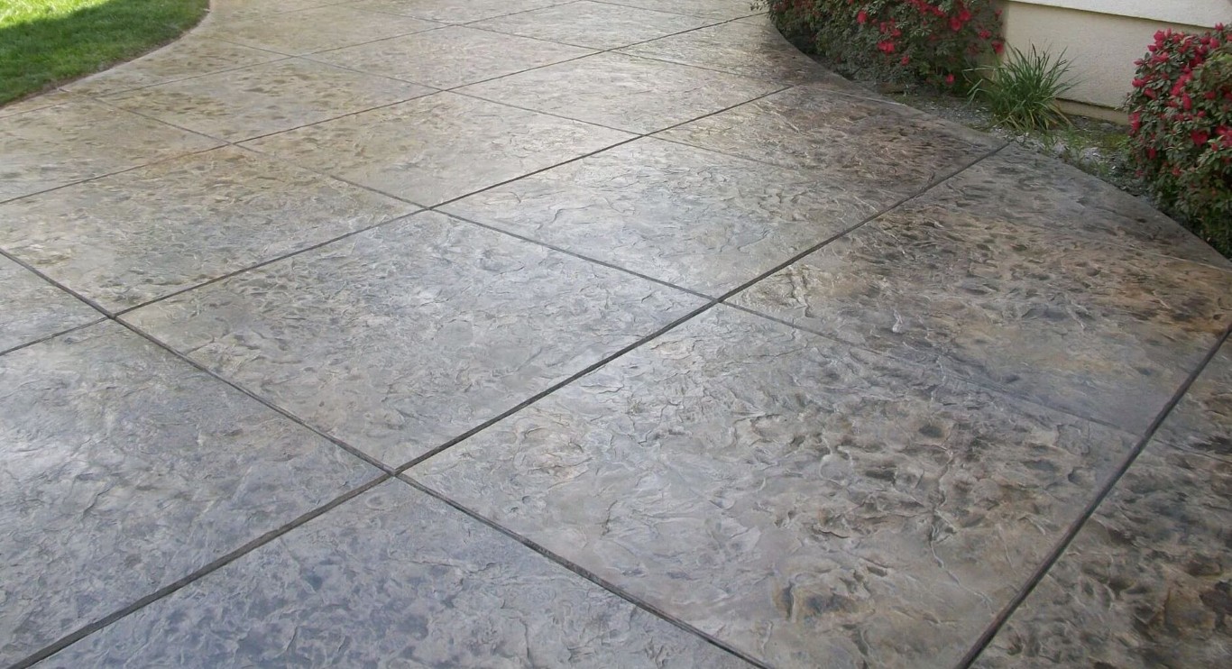 Beautiful stamped decorative concrete patio installation in Metairie, LA
